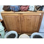 A solid pine 2 door cupboard