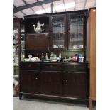 A darkwood stained dresser / wall unit