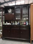 A darkwood stained dresser / wall unit