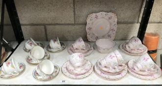 A Tuscan pink floral porcelain tea set and 1 other