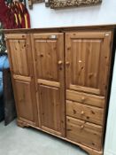 A modern solid pine Ducal cupboard with drawers