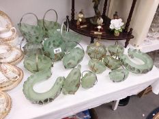 A lot of green glass in metal baskets