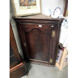 A Victorian oak corner cupboard