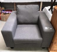 A grey fabric armchair