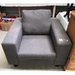 A grey fabric armchair