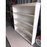 A set of white painted book shelves