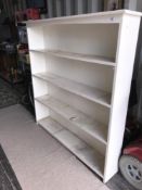 A set of white painted book shelves
