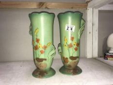 A pair of art pottery vases,