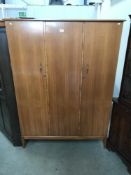 A vintage AC handcraft quality triple wardrobe