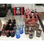A quantity of Coca Cola coke glasses and bottles etc.