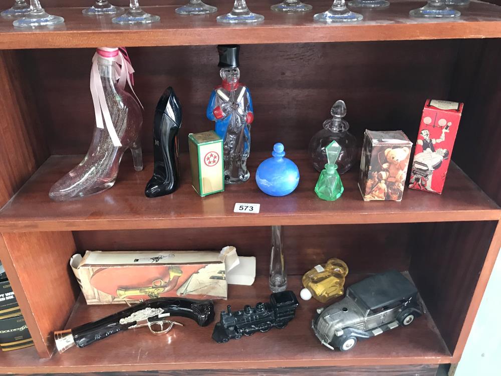 A quantity of perfume bottles by Avon etc (2 shelves)