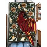 A wool wall hanging/rug in a parrot design