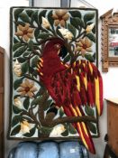 A wool wall hanging/rug in a parrot design