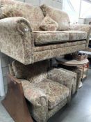 A brown floral 2 seater sofa with matching armchair and footstool