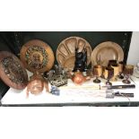 A shelf of wooden carved items including buddah, face mask etc.