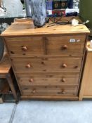 A modern solid pine chest of drawers