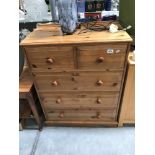 A modern solid pine chest of drawers