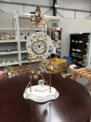 A classical design gilded metal and porcelain quartz mantle clock