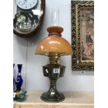 An Aladdin paraffin lamp with shade and chimney