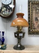 An Aladdin paraffin lamp with shade and chimney
