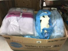 A box of blankets, dressing gowns etc including new items etc.