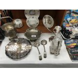 A mixed lot of silver plate including candelabra, ice bucket etc.