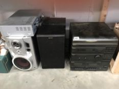 A Sony Hi-Fi system with speakers, a pair of LG speakers and a Digi Logic video recorder