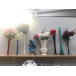 6 tall coloured glass spill vases including artificial flowers