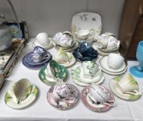A quantity of porcelain cups and saucers