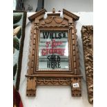 A carved framed mirror with Will's cigars advertising