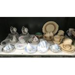 A shelf of porcelain tea ware including Royal Albert