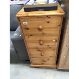 A modern solid pine 4 drawer chest of drawers