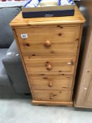 A modern solid pine 4 drawer chest of drawers