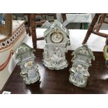 An early 20th Century continental bisque 3 piece clock set with modern movement