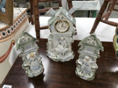 An early 20th Century continental bisque 3 piece clock set with modern movement