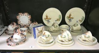 A continental pottery windmill pattern tea set and 1 other