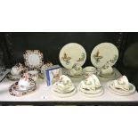 A continental pottery windmill pattern tea set and 1 other