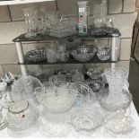 A large quantity of crystal, cut and moulded glass including vases, candle sticks etc.