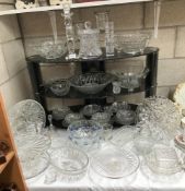 A large quantity of cut and moulded glass including cube glass bowl etc.