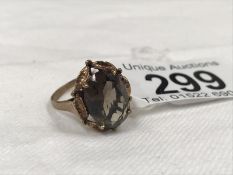A gold ring set smoky quartz size N (hallmark rubbed)