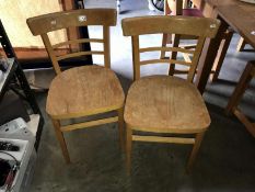 A pair of kitchen chairs