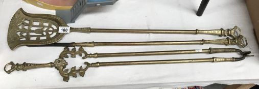 A set of 3 brass fire irons