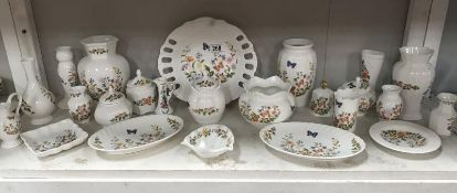 A shelf of Aynsley cottage garden including vases etc.