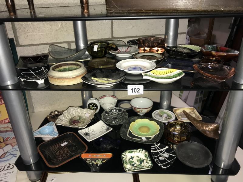 A quantity of glass and china dishes including advertising