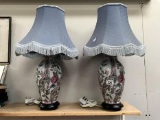 A pair of pottery table lamps with shades