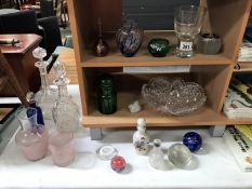 A mixed lot of glassware including decanters, scent bottles, paperweights etc.