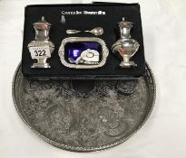 A cased silver plate salt and pepper pot and a silver plate tray