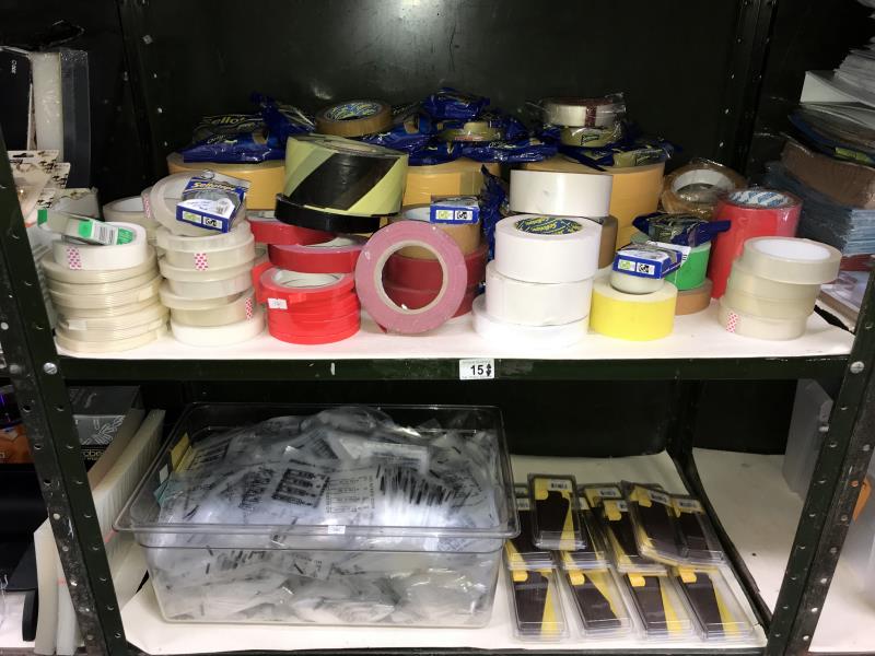 2 shelves of various sticking tape, coin bags etc.