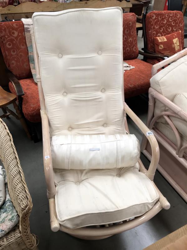 A white swivel chair