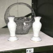 A glass basket and a pair of vases